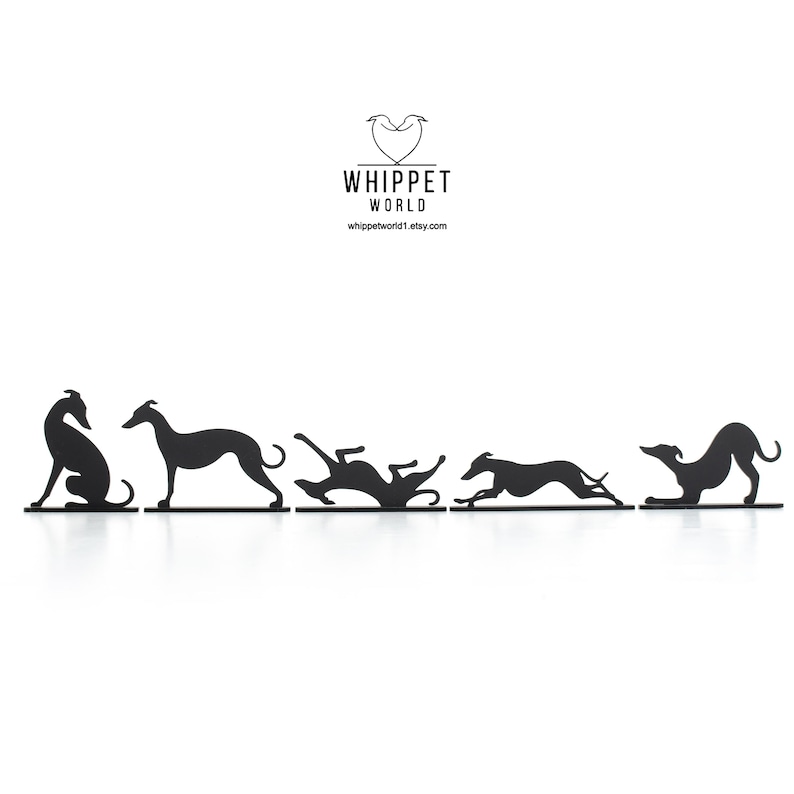 May include: Black metal Whippet dog silhouettes in various poses, including sitting, standing, and running. The silhouettes are arranged in a row, with the Whippet World logo at the top. The background is white.