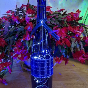 Wine bottle lights/Holiday themed wine bottle/Chrstmas lighted wine bottles/Christmas decor/Christmas gift/ upcycled decor