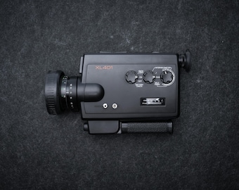 Minolta XL 401 Super 8 Camera, 1970s Compact Design, f/1.2 Rokkor Lens, Reflex Viewfinder With Split Image, Manual And Auto Exposure