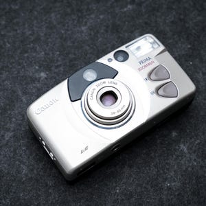 Canon Prima Zoom 85N + free 35mm film – 35mm point-and-shoot camera – 1998 – new in box, old stock