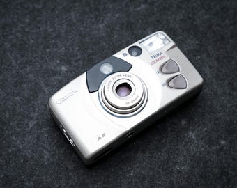 Canon Prima Zoom 85N + gratis 35mm film – 35mm point-and-shoot camera – 1998 – nieuw in doos, old stock