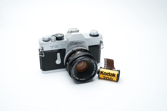 Canon TX 35mm SLR camera FD 50mm f1.8 lens werkend getest met film