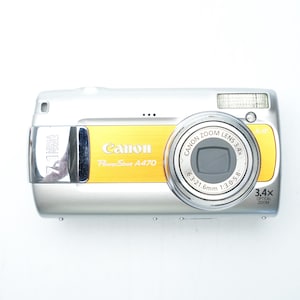 Canon PowerShot A470 – cámara digital compacta – 7,1 MP – zoom óptico de 3,4x – color amarillo plateado – con caja original