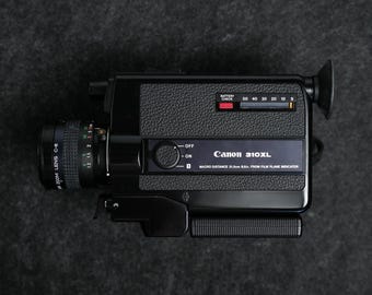 Vintage Canon 310xl, f1.0 low light lens, retro 1975 film camera, compact collectible for weddings travel creators