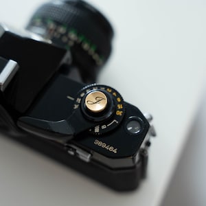 Personalize your camera with a unique laser-engraved shutter button!