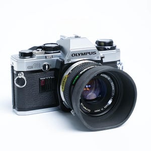 Olympus OM-10 35mm SLR with Zuiko 50mm f/1.8 Lens + Kodak Gold Film (1979–1983, Tested & Ready)