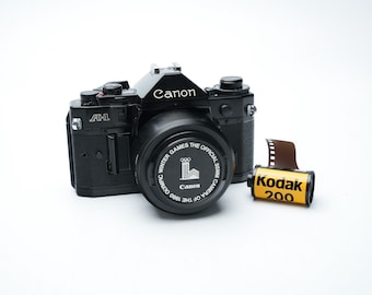 Canon A-1 with Canon FD 50mm f/1.8 & Free 35mm Film – Vintage SLR Camera
