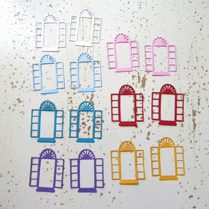 May include: Assortment of 12 die-cut window shapes in various colors, including white, blue, red, yellow, and purple. Each window shape is made of cardstock and features a traditional arched top and multiple panes.