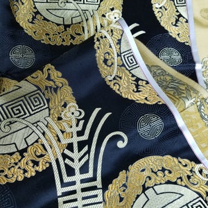 Fabric Silk Brocade Black and color Gold Medallion w/symbol Remnants 3 yards