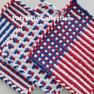May include: Three square woven potholders featuring a Patriotic Collection label. The designs include red, white, and blue checkered patterns and a striped flag motif. Each item has a braided border made from thick fabric loops in matching colors.