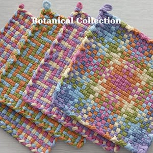 May include: Three square potholders featuring a woven, multicolored grid pattern in shades of blue, green, orange, pink, and cream. Each potholder has a small hanging loop at the top corner. The text Botanical Collection is printed at the top.