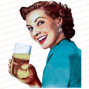 May include: A woman with red hair and a turquoise dress holds a glass of beer. She is smiling and looking at the camera.