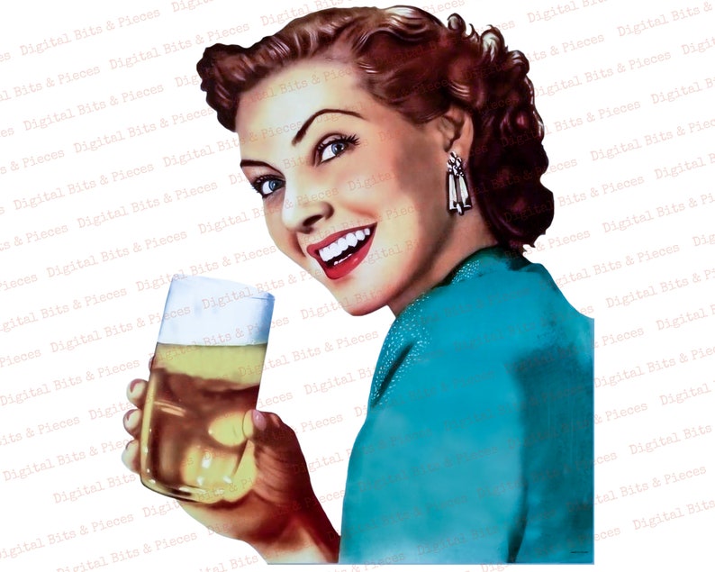 May include: A woman with red hair and a turquoise dress holds a glass of beer. She is smiling and looking at the camera.