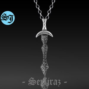 May include: Silver pendant necklace featuring a detailed sword design. The sword has a decorative handle and a pointed blade. The chain is silver and has a classic link style.