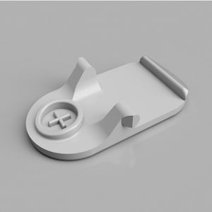 May include: A white plastic phone stand with a raised plus sign in the center. The stand has a curved design and a flat base.