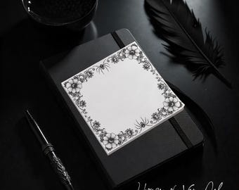 May include: A black and white composition featuring a notepad with a floral and spider border, resting on a black journal. A black pen, a bowl, and a feather are also present. The text "House of Van Del" is at the bottom.