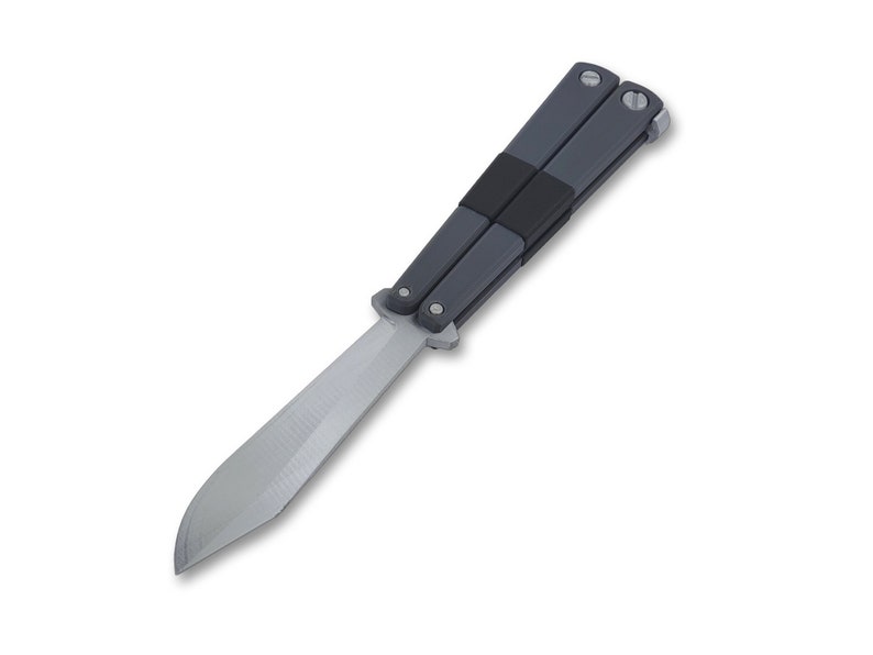 May include: A butterfly knife with a silver blade and gray handles. The handles are connected by a black rubber band. The knife is open, displaying the full length of the blade. The knife is set against a white background.
