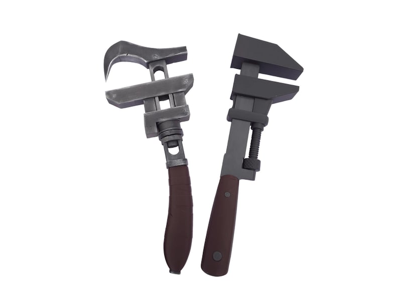 May include: Two adjustable wrenches with dark gray metal heads and brown handles are displayed against a white background. The wrenches are designed for gripping and turning nuts and bolts. One wrench has a curved jaw, and the other has a flat jaw.