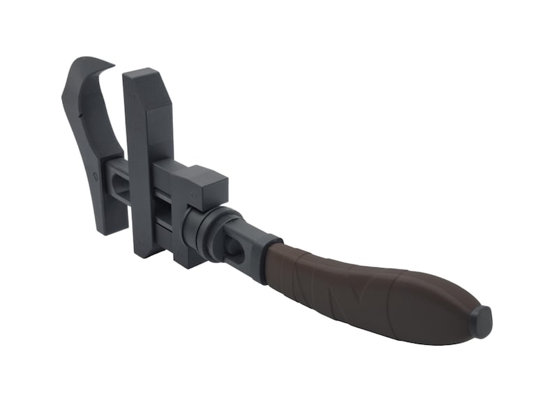 May include: A dark gray adjustable wrench with a brown handle. The tool has a curved jaw and a sliding adjustment mechanism. The handle is textured for grip.