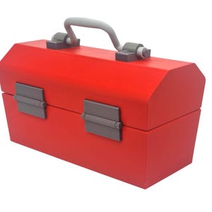 May include: A bright red toolbox with a gray handle and latches. The toolbox is rectangular with an angled top and is designed to carry tools. The handle is arched and the latches are rectangular.