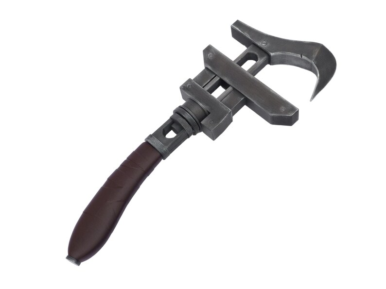 May include: A dark gray adjustable wrench with a curved hook end and a brown leather-wrapped handle. The tool is designed for gripping and turning objects, and it is set against a white background.