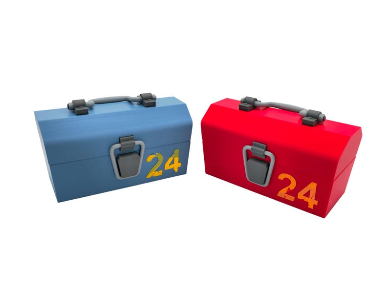 May include: Two wooden toolboxes, one blue and one red, each with a gray handle and latch. The number "24" is printed in yellow on the front of each box. The toolboxes are rectangular with a slightly angled top.