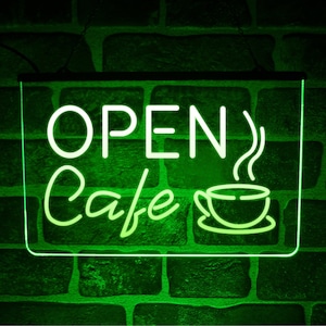 Peut inclure: Enseigne au néon verte avec les mots "OPEN CAFE" et une image stylisée d'une tasse de café avec de la vapeur qui s'en échappe.