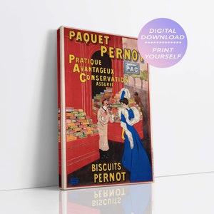 Puede incluir: Un cartel publicitario francés vintage para las galletas Paquet Pernot. El cartel presenta un fondo rojo con una tienda y dos personas. El texto en el cartel dice "Paquet Pernot, Pratique, Avantageux, Conservation Assuree, Biscuits Pernot".