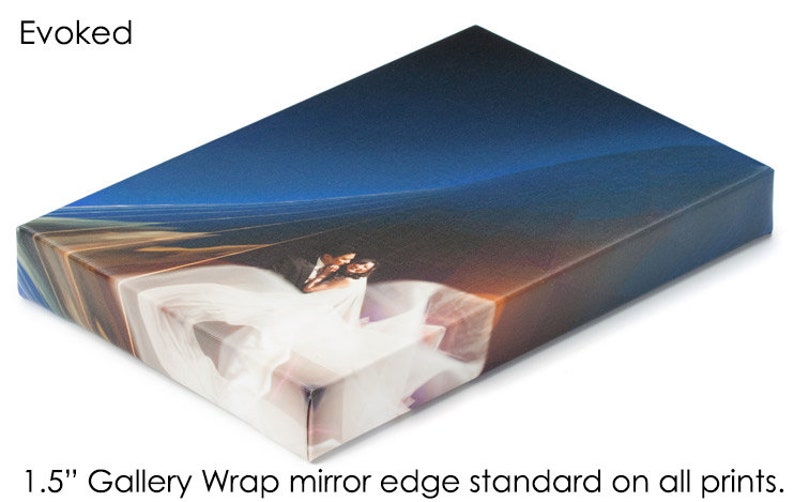 May include: A 1.5 inch gallery wrap canvas print with a mirror edge. The print features a couple in a white dress and a blue suit, standing in front of a blue and orange sky.