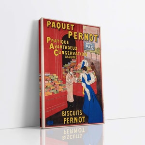 Puede incluir: Anuncio vintage para las galletas Paquet Pernot. El anuncio presenta un fondo rojo con texto amarillo que dice "Paquet Pernot" y "Biscuits Pernot". El anuncio también presenta a una mujer con un vestido azul y un hombre con una bata blanca de pie frente a una pantalla de galletas.