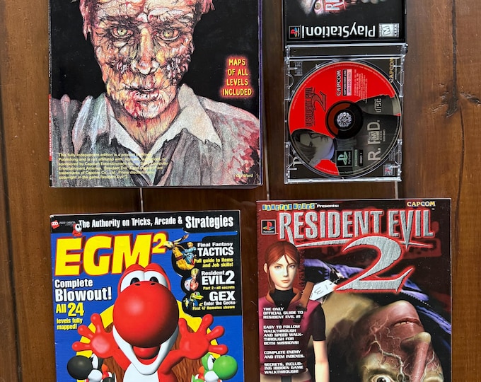 Resident Evil 2(PlayStation 1, 1998) black label. CIB. - 2 Disc GAME - With Three Collector Strategies Guide Books