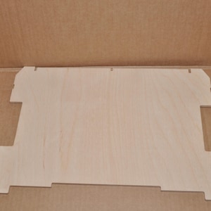 May include: A plain, unfinished wooden board with a rectangular shape and slightly rounded edges. The board is light brown in colour and has a smooth surface.