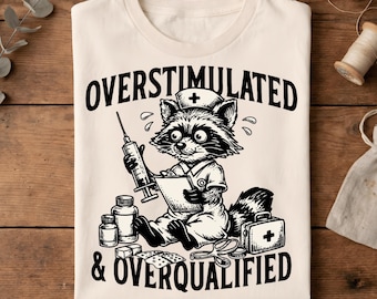 Overstimulated and Overqualified Funny Feral Nurse T-Shirt, Nurse Humor Gift, Overworked Nurse Life Graphic Tee