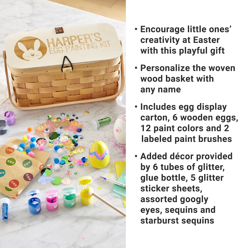 Puede incluir: Una cesta de madera con las palabras "HARPER'S EGG PAINTING KIT" en la tapa. La cesta est&aacute; llena de suministros para manualidades para decorar huevos de Pascua, incluyendo pintura, purpurina, ojos saltones y lentejuelas.