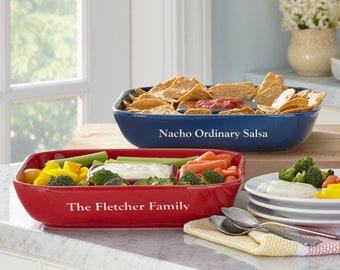 May include: Two ceramic serving dishes, one red and one blue, with compartments for dips and snacks. The red dish has the text "The Fletcher Family" and the blue dish has the text "Nacho Ordinary Salsa".