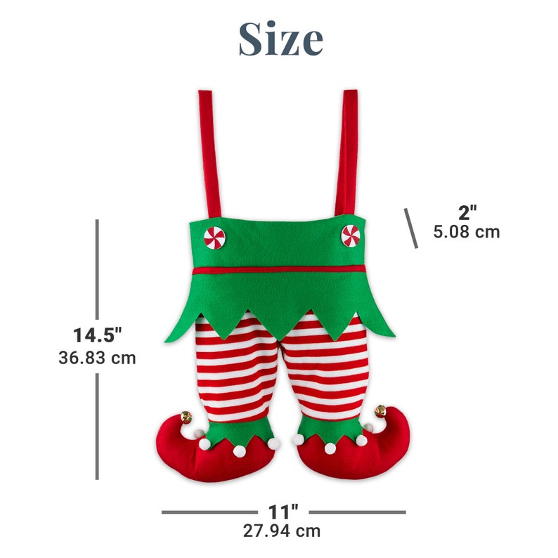 May include: A festive Christmas elf stocking in the shape of legs, featuring red and white striped pants, green suspenders, and red shoes with bells. The stocking is 14.5 inches (36.83 cm) tall and 11 inches (27.94 cm) wide.