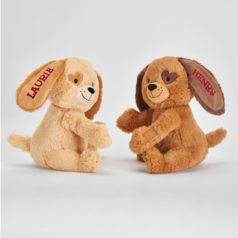 May include: Two plush brown and beige dog toys with embroidered names "Laurie" and "Henry".