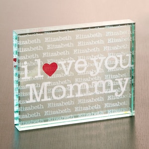 May include: A glass block with the words "I love you Mommy" in white lettering and a red heart. The background of the block is filled with the word "Elizabeth" repeated many times.