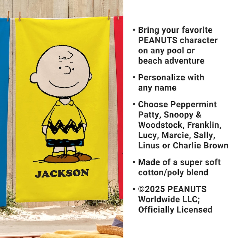 May include: Yellow beach towel featuring Charlie Brown from Peanuts. The towel has a large image of Charlie Brown in his signature outfit, with the name "JACKSON" printed below. The towel is made of a soft cotton/poly blend.