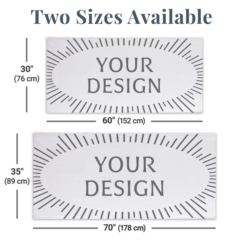 May include: Two sizes of white bath towels with a grey oval design that says "YOUR DESIGN". The smaller towel is 30 inches by 60 inches (76 cm by 152 cm). The larger towel is 35 inches by 70 inches (89 cm by 178 cm).