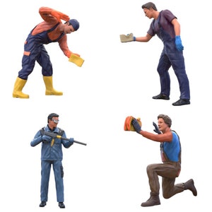 May include: Four figures wearing blue and orange workwear. One figure is holding a yellow sponge, another is holding a blue sponge, another is holding a gun, and the last figure is holding a yellow sponge and kneeling.