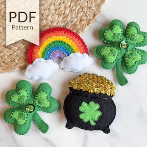 May include: A set of felt craft patterns for making four St. Patrick's Day decorations: a rainbow, a pot of gold, and two shamrocks. The PDF pattern is available for download.