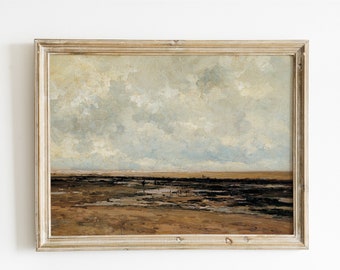 May include: A framed painting of a seascape with a cloudy sky and a sandy beach with a receding tide. The painting is in a light wood frame.