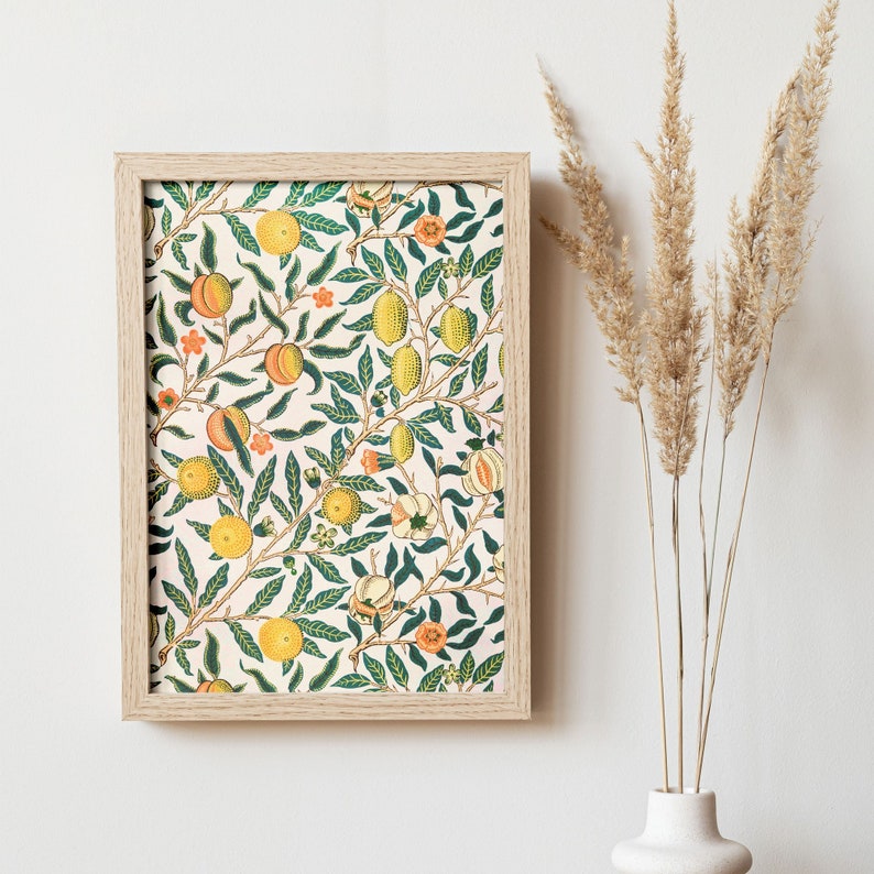 May include: A framed print of a vintage botanical illustration featuring a repeating pattern of stylised fruit and leaves in shades of green, yellow, and orange on a white background.