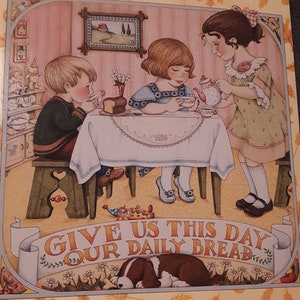 May include: A vintage-style illustration of three children having tea party with a dog. The children are dressed in colorful clothing and are sitting at a table with a white tablecloth. The text "Give us this day our daily bread" is written in a banner above the dog.