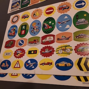 Transportation-themed stickers, 9 sheets for scrapbooks, photo albums and card-making. glitter cars trains boats planes signs helicopters
