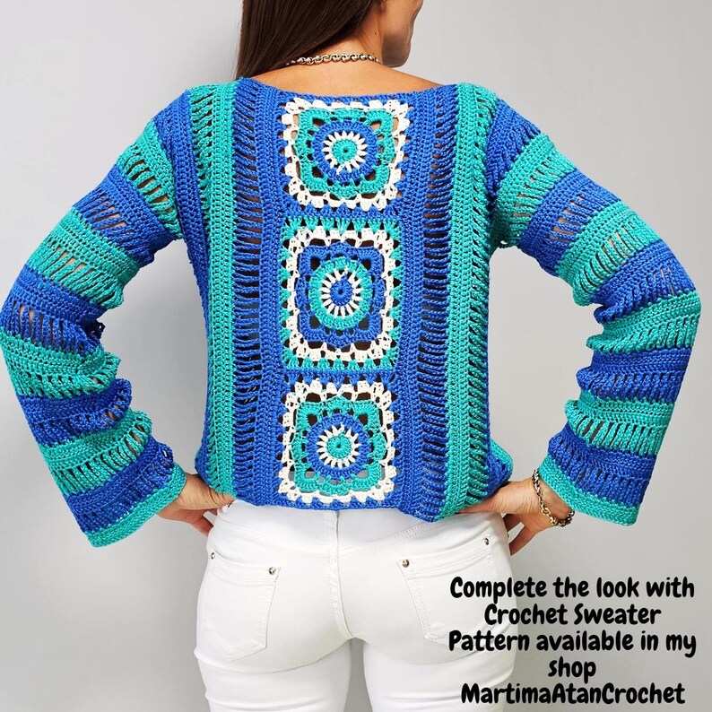 May include: A long-sleeved crochet sweater featuring a central vertical panel of three square motifs in blue, turquoise, and white. The sleeves and sides are constructed with horizontal stripes of blue and turquoise yarn in an openwork stitch.