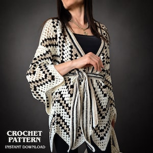 May include: A cream, black, and tan crochet cardigan with a geometric pattern. The cardigan has a tie belt and wide sleeves. The words "CROCHET PATTERN" and "INSTANT DOWNLOAD" are printed at the bottom of the image.