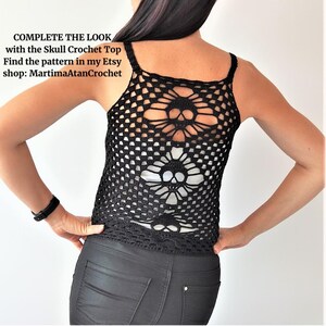 May include: A black crochet tank top featuring a repeating skull motif pattern throughout the garment. The text on the image reads: COMPLETE THE LOOK with the Skull Crochet Top Find the pattern in my Etsy shop: MartimaAtanCrochet.