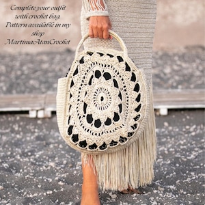 May include: A round beige crochet bag with a detailed circular lace pattern and a solid black interior lining. The bag features a matching beige crochet handle and long fringe trim along the bottom edge. Text reads: Complete your outfit with crochet bag. Pattern available in my shop MartimaAtanCrochet.